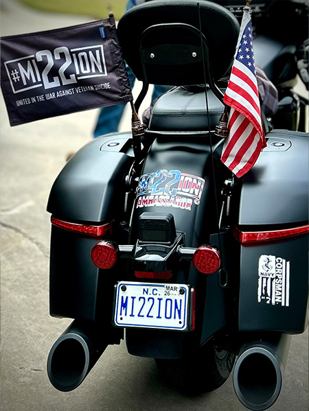 Back of motorcycle with mission22 flag
